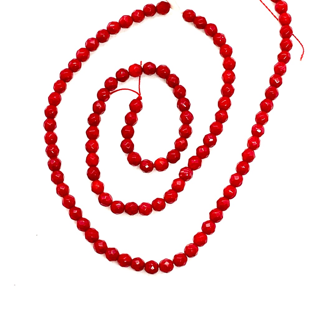 Strand Of Faceted Coral Beads